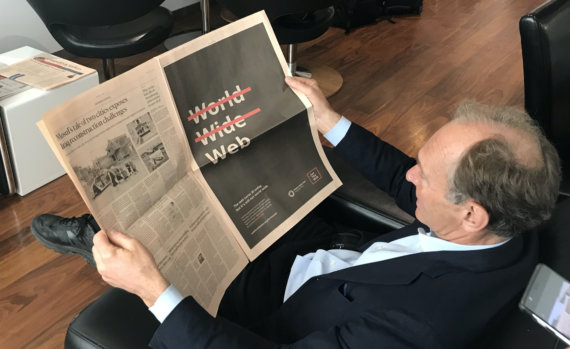 Photo of Sir Tim Berners-Lee reading the Financial Times with Web Foundation advertisement